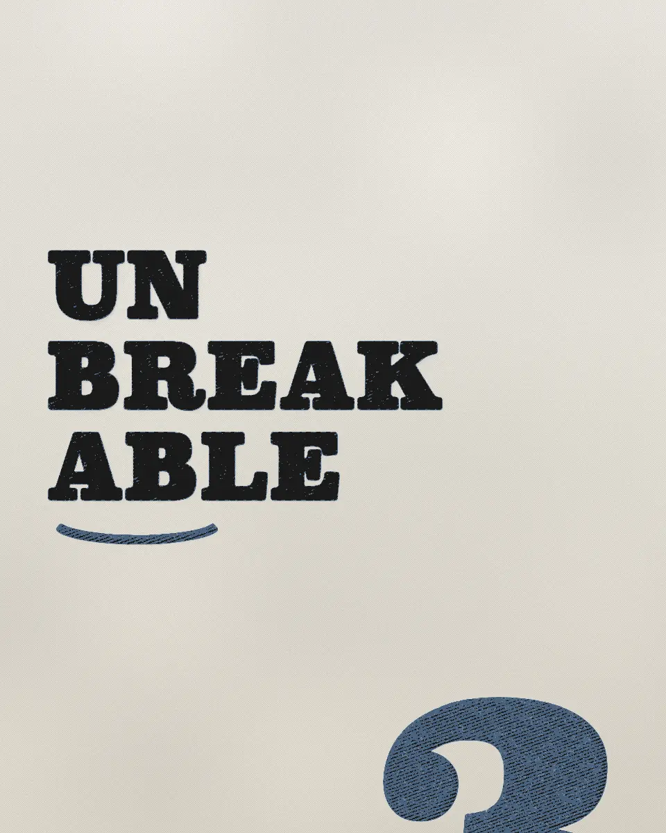 A letterpress proof: UN, BREAK, ABLE in black wood type over a hand-drawn tie, and a large 3 in a blue ink beside them.