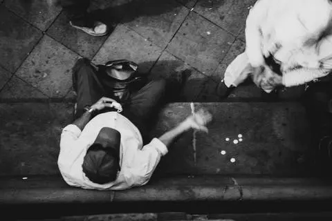 Centro Histórico, Quito, 2025. A man on a bench, seen from above.