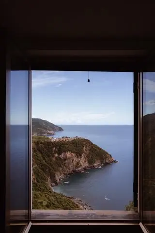Cinque Terre, 2024. The coast and the sea through an open window.