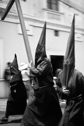 Quito, 2026. Cucuruchos walking in the Good Friday procession.