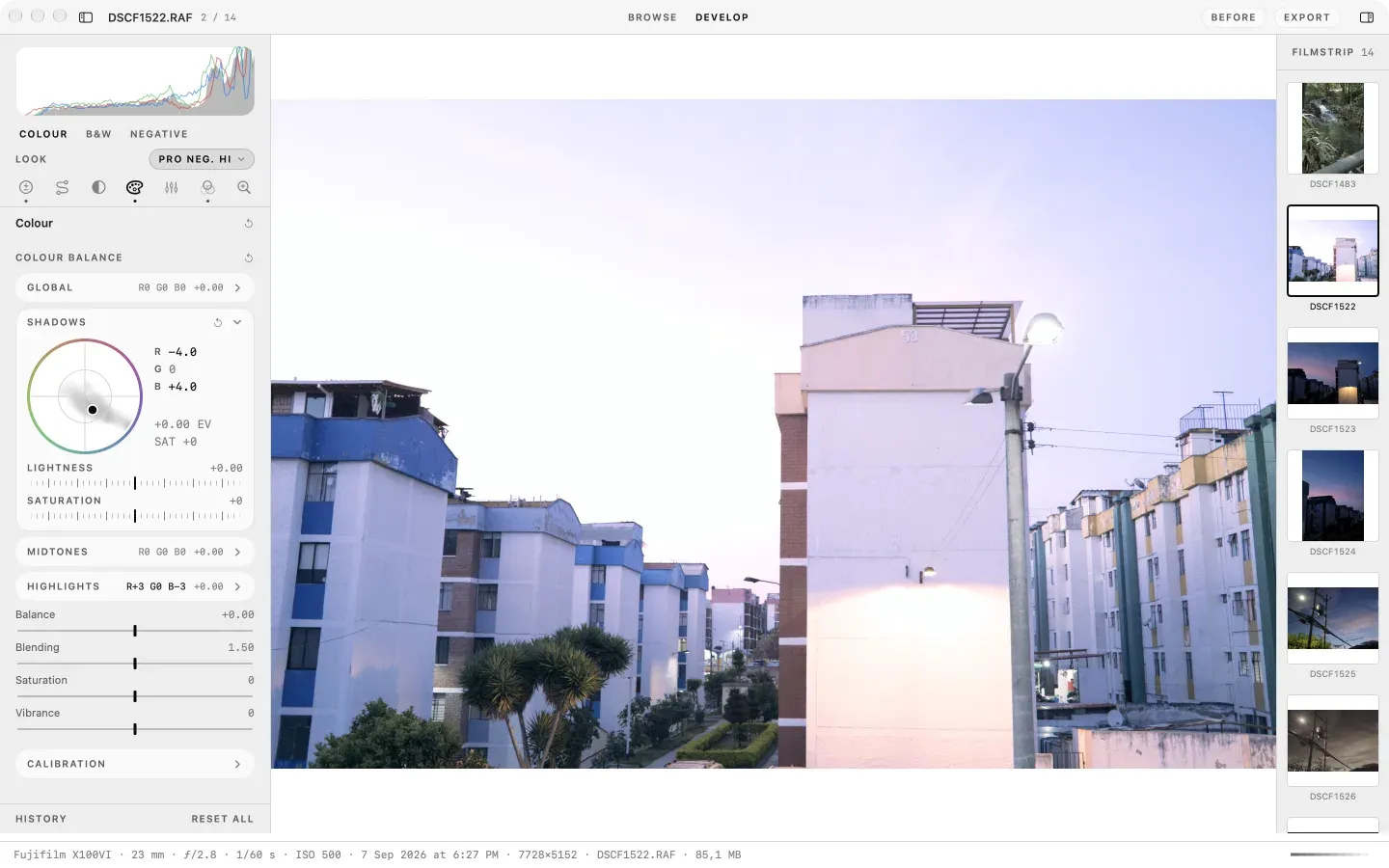 Develop on the Colour tab: the seven tool tabs as a row of glyphs, the Shadows wheel open at red minus 4 and blue plus 4, the highlights row at red plus 3 and blue minus 3, and slider rows below, over a dusk street